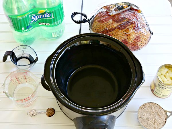 The Best Holiday Ham recipe, cooked in the slow cooker and served with a Yummy Sauce